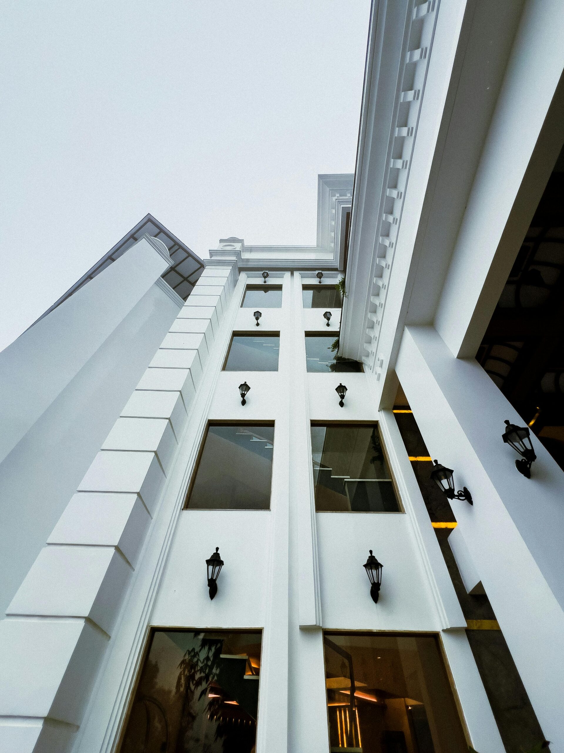 Contemporary architecture of a modern high-rise building with reflective windows.